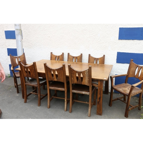 603 - 20th century oak Arts & Crafts style dining table and eight (six plus two) chairs.