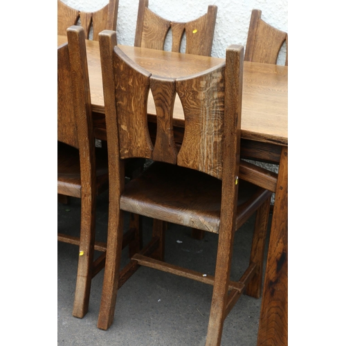 603 - 20th century oak Arts & Crafts style dining table and eight (six plus two) chairs.