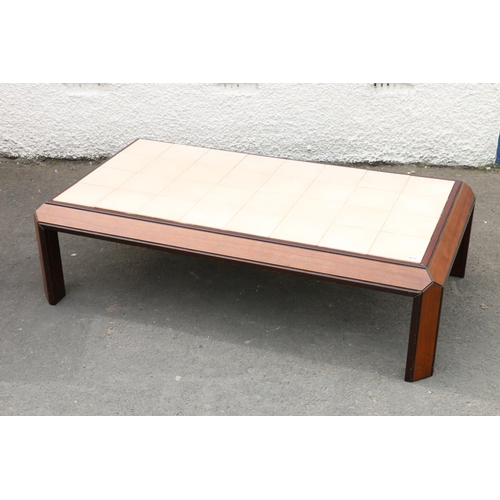 607 - Mid-20th century design mahogany coffee table by G-Plan, the tiled top above sloping frieze, raised ... 