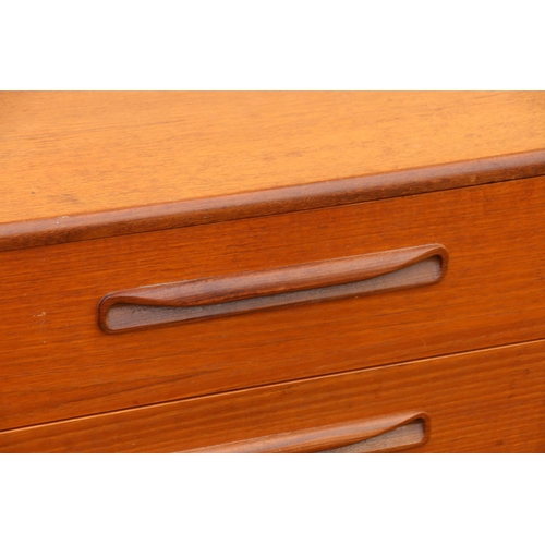 611 - 1960s teak sideboard by G-Plan, the three graduated central drawers flanked by angled twin door cabi... 