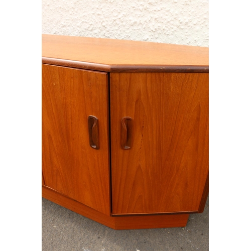 611 - 1960s teak sideboard by G-Plan, the three graduated central drawers flanked by angled twin door cabi... 