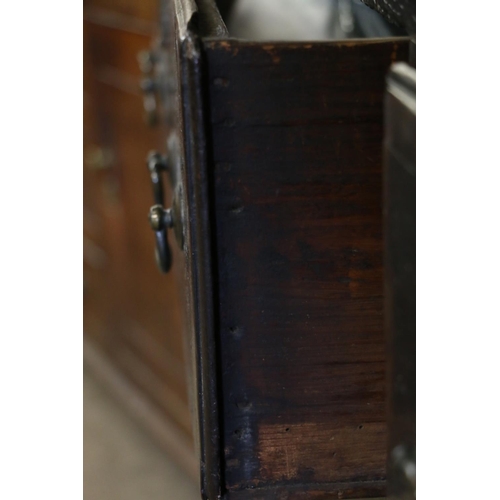 646 - 18th century dresser, the panelled plate rack over base with three drawers, shaped apron, raised on ... 