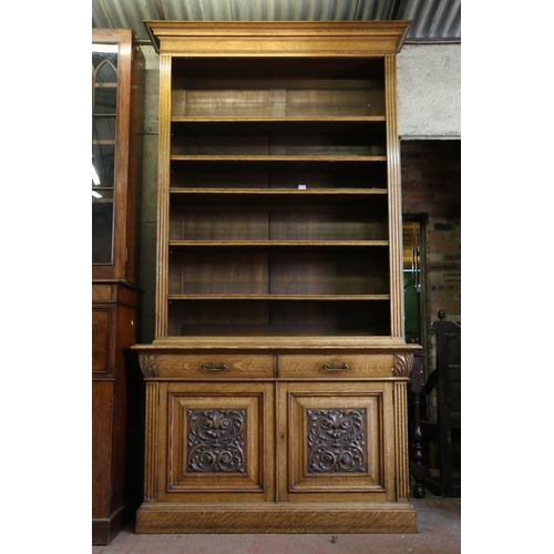 651 - Late 19th/early 20th century open bookcase, on base, with the moulded cornice over adjustable shelve... 