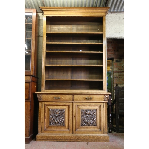 651 - Late 19th/early 20th century open bookcase, on base, with the moulded cornice over adjustable shelve... 