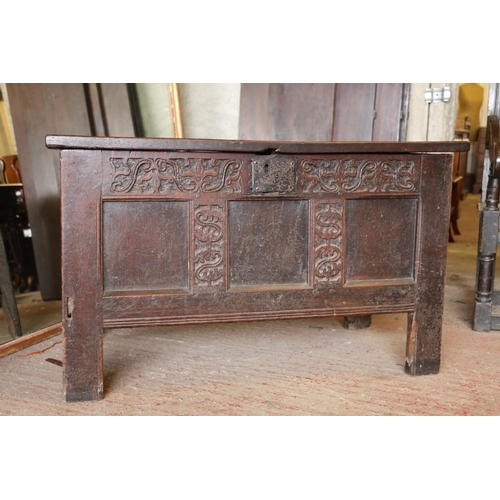 652 - 17th century oak coffer, the panelled top on later hinges, interior with candle box lacking lid, fro... 