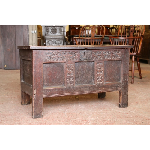 652 - 17th century oak coffer, the panelled top on later hinges, interior with candle box lacking lid, fro... 