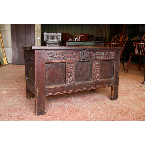 652 - 17th century oak coffer, the panelled top on later hinges, interior with candle box lacking lid, fro... 