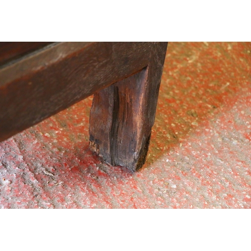 652 - 17th century oak coffer, the panelled top on later hinges, interior with candle box lacking lid, fro... 