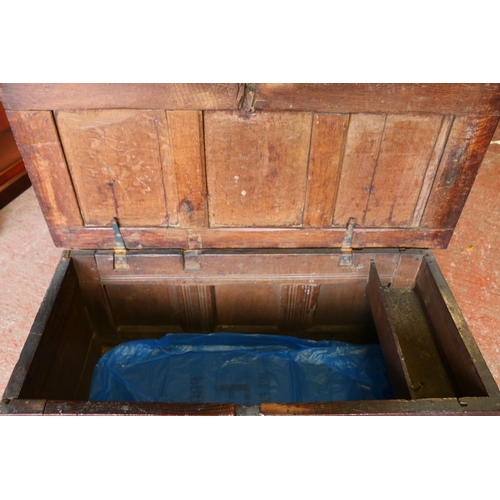 652 - 17th century oak coffer, the panelled top on later hinges, interior with candle box lacking lid, fro... 