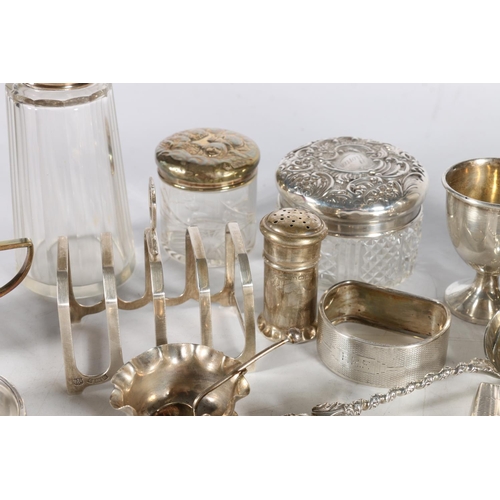 50Q - Group of silver items to include a five bar toast rack by Barker Brothers Silver Ltd, Birmingham 197... 