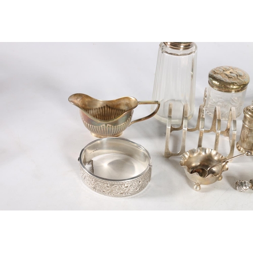 50Q - Group of silver items to include a five bar toast rack by Barker Brothers Silver Ltd, Birmingham 197... 