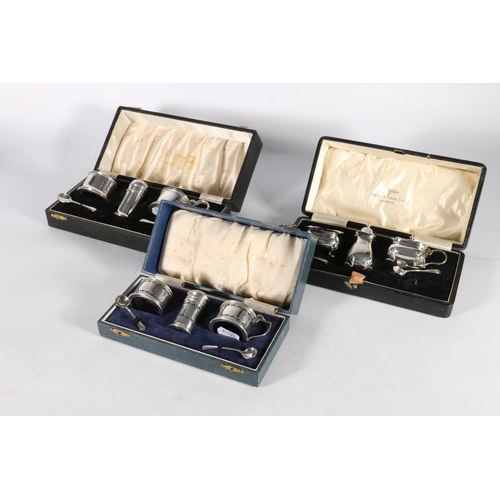 61 - Silver three-piece cruet set by William Suckling Ltd, Birmingham, various dates with non-matching sp... 