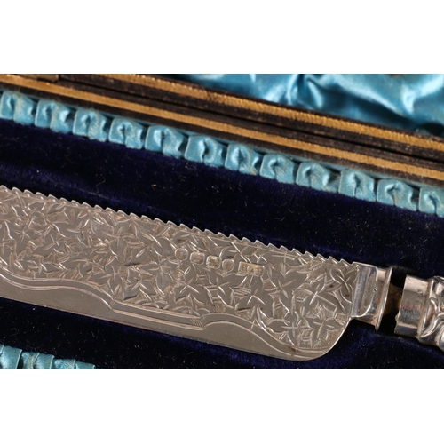 67E - Victorian silver corn on the cob knife with serrated back and leaf decorated blade on handle with co... 