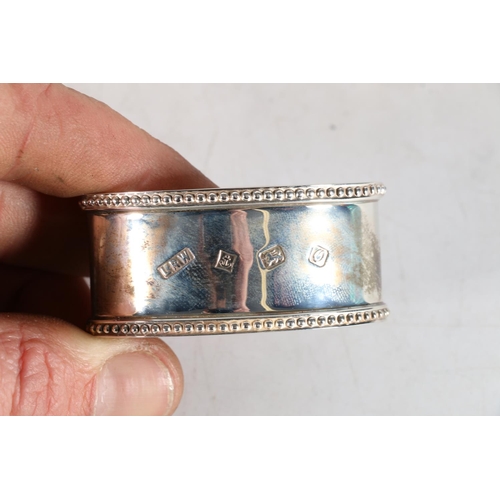 67M - Set of 8 silver napkin rings hallmarked for Laurence R Watson & Co, Birmingham 1986, and re... 