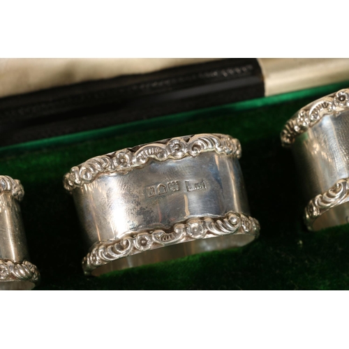 9 - Set of six silver napkin rings with C scroll and floral bands by Mappin and Webb, London 1910, 160g ... 