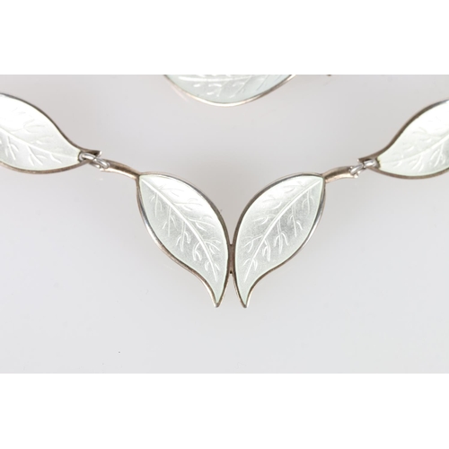 181 - Willy Winnaess for David Andersen of Norway, a Norwegian Sterling silver and white enamel leaf link ... 