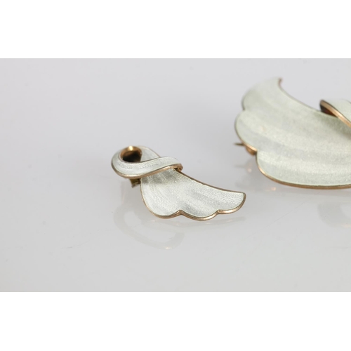 187 - David Andersen of Norway, a Norwegian Sterling silver and white enamel brooch of wave shape with mat... 