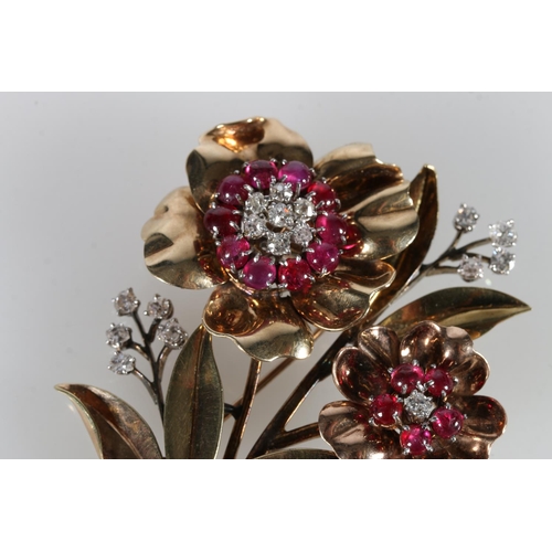 214 - Unhallmarked yellow metal floral bouquet brooch set with rubies and diamonds, 27g gross, 8cm long.