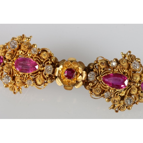 228 - Unhallmarked yellow metal diamond and ruby bar brooch with filigree work, 11g gross.