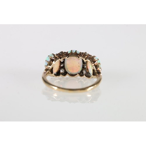 92 - 18ct gold opal and diamond eleven stone dress ring, ring size, O/P, 3.8g.