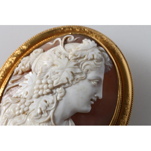 94 - Large unhallmarked yellow metal mounted oval cameo brooch with bust of a maiden with fruiting vine l... 