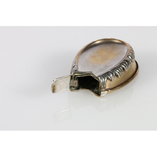 355A - Silver-plated vesta case in the form of a horseshoe, and a brass vesta case modelled as a horse’s le... 