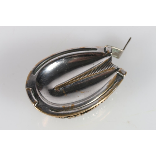 355A - Silver-plated vesta case in the form of a horseshoe, and a brass vesta case modelled as a horse’s le... 