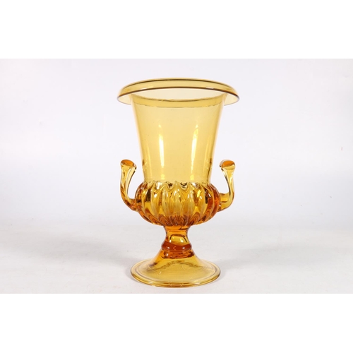 500A - Regency style yellow tinted Campana shaped and gadrooned glass vase, 24cm.