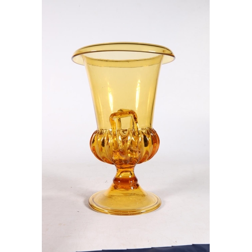 500A - Regency style yellow tinted Campana shaped and gadrooned glass vase, 24cm.