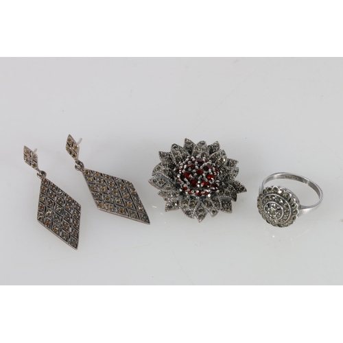 505A - Silver, garnet and marcasite brooch, marcasite diamond earrings, and a ring, size Q.