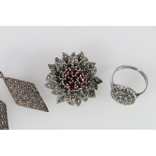 505A - Silver, garnet and marcasite brooch, marcasite diamond earrings, and a ring, size Q.