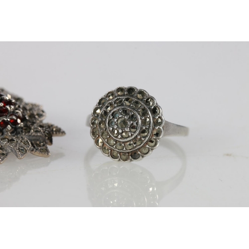 505A - Silver, garnet and marcasite brooch, marcasite diamond earrings, and a ring, size Q.