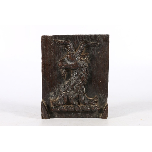 570A - Late 18th century carved oak panel depicting a horned goat of a family crest, 16 x 13cm.