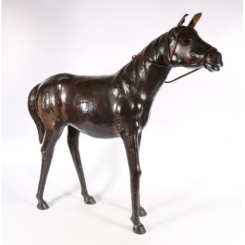 585A - Leather equestrian horse sculpture with glass eyes, 66cm high.