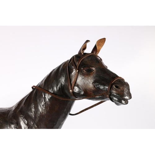 585A - Leather equestrian horse sculpture with glass eyes, 66cm high.