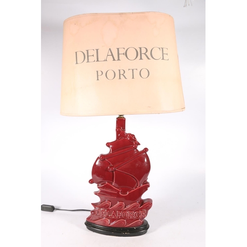 80A - 1920s advertising lamp and original shade for Delaforce Porto with stylised sailing ship, 73cm.