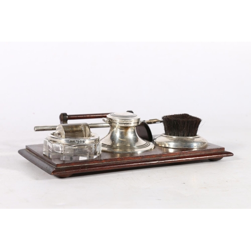 85A - Silver and wood desk tray fitted with a capstan inkwell, a nib wipe and a stamp or envelope roller, ... 