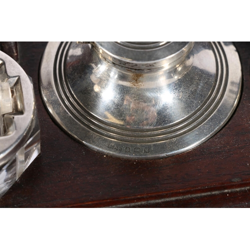 85A - Silver and wood desk tray fitted with a capstan inkwell, a nib wipe and a stamp or envelope roller, ... 