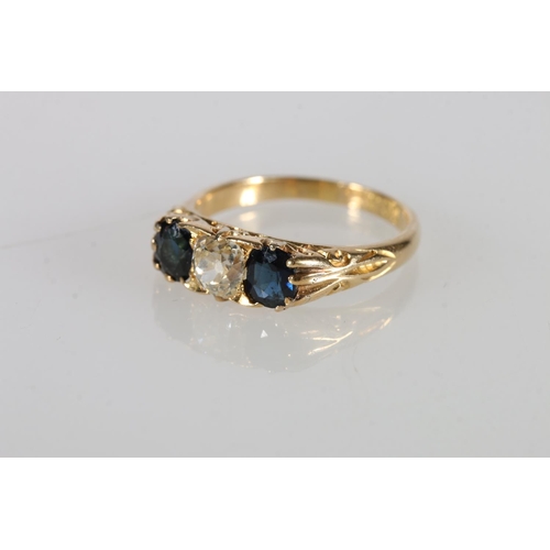 117 - 18ct gold sapphire and diamond three stone ring, the central diamond approximately 0.5cts flanked by... 