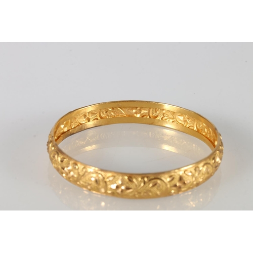 144 - Traditional Indian style bangle with repousse floral design, 15.3g.