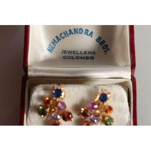 205 - Sri Lankan unhallmarked yellow metal gemstone set spray brooch 9.6g, and a pair of matching earrings... 