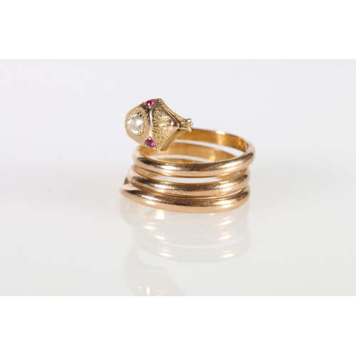 73 - 18ct gold snake ring, the eyes picked out with small rubies and a large teardrop shaped diamond set ... 