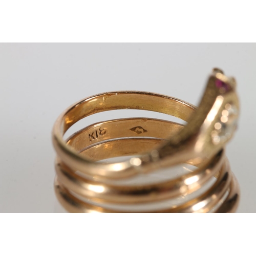 73 - 18ct gold snake ring, the eyes picked out with small rubies and a large teardrop shaped diamond set ... 