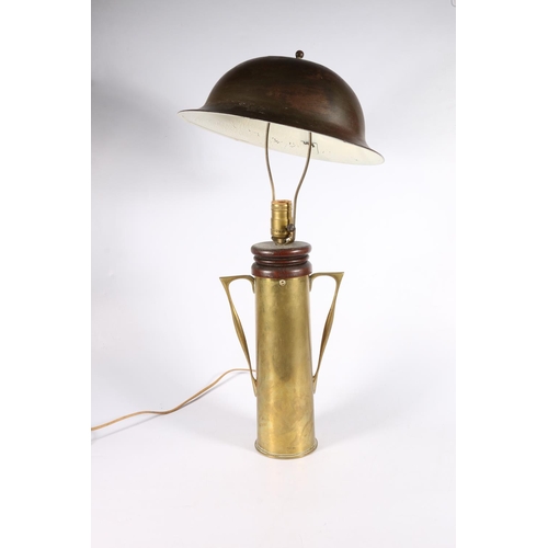 364 - WWI 'Trench Art' table lamp made from a 1916 artillery shell casing with a Brodie style steel helmet... 