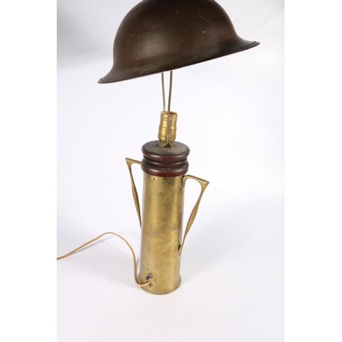 364 - WWI 'Trench Art' table lamp made from a 1916 artillery shell casing with a Brodie style steel helmet... 