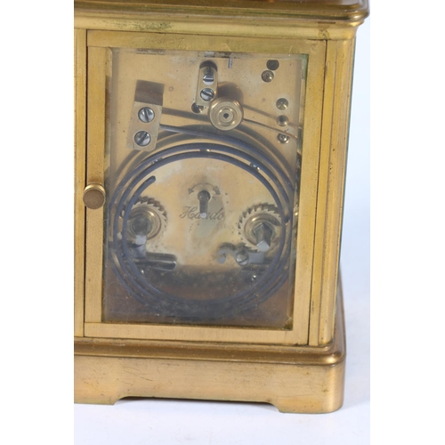 381 - Howell James & Co of London, a French gilt brass carriage clock, the white enamel dial with Arab... 