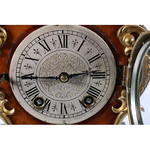 384 - German ormolu mounted mantle clock in the French Rococo style, the silvered dial with Roman numeral ... 