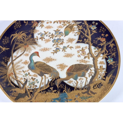 464 - Large Austrian porcelain charger decorated with Japanese style scene with cranes or egrets, dragonfl... 