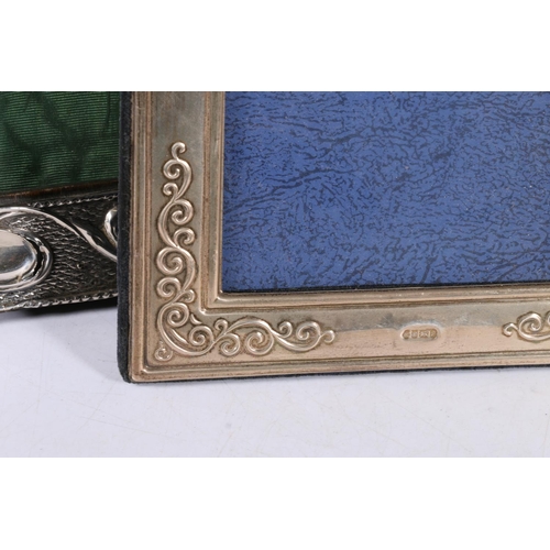 67P - Group of four hallmarked silver picture frames, and one white metal with elaborate rococo frame, 22c... 