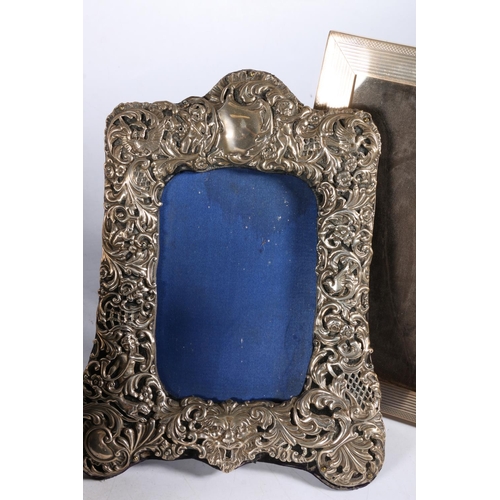 67P - Group of four hallmarked silver picture frames, and one white metal with elaborate rococo frame, 22c... 